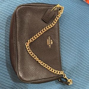 Excellent Clutch/Wristlet purse.. interior has Two slots for credit cards